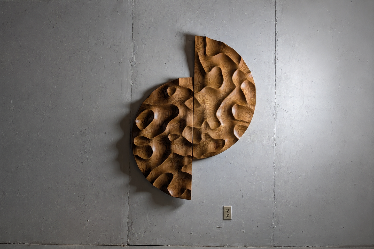 Wooden wall sculpture on a gray wall